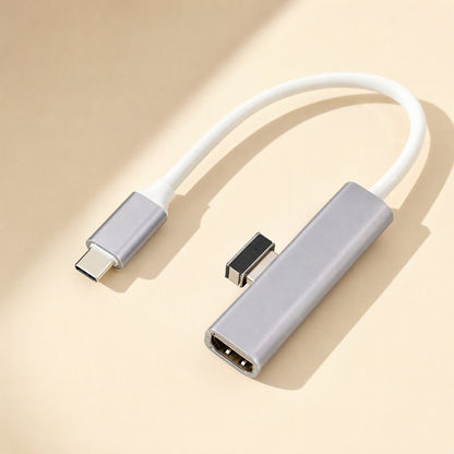 Metalbay – Gray aluminum USB-C adapter with white cable and a single HDMI port, shown on a beige surface