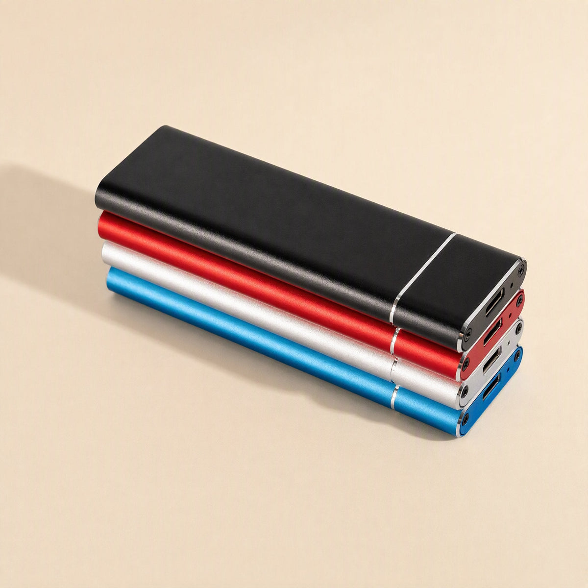 Bytecove – Stack of four M.2 SSD enclosures in black, red, silver and blue with USB-C ports facing forward