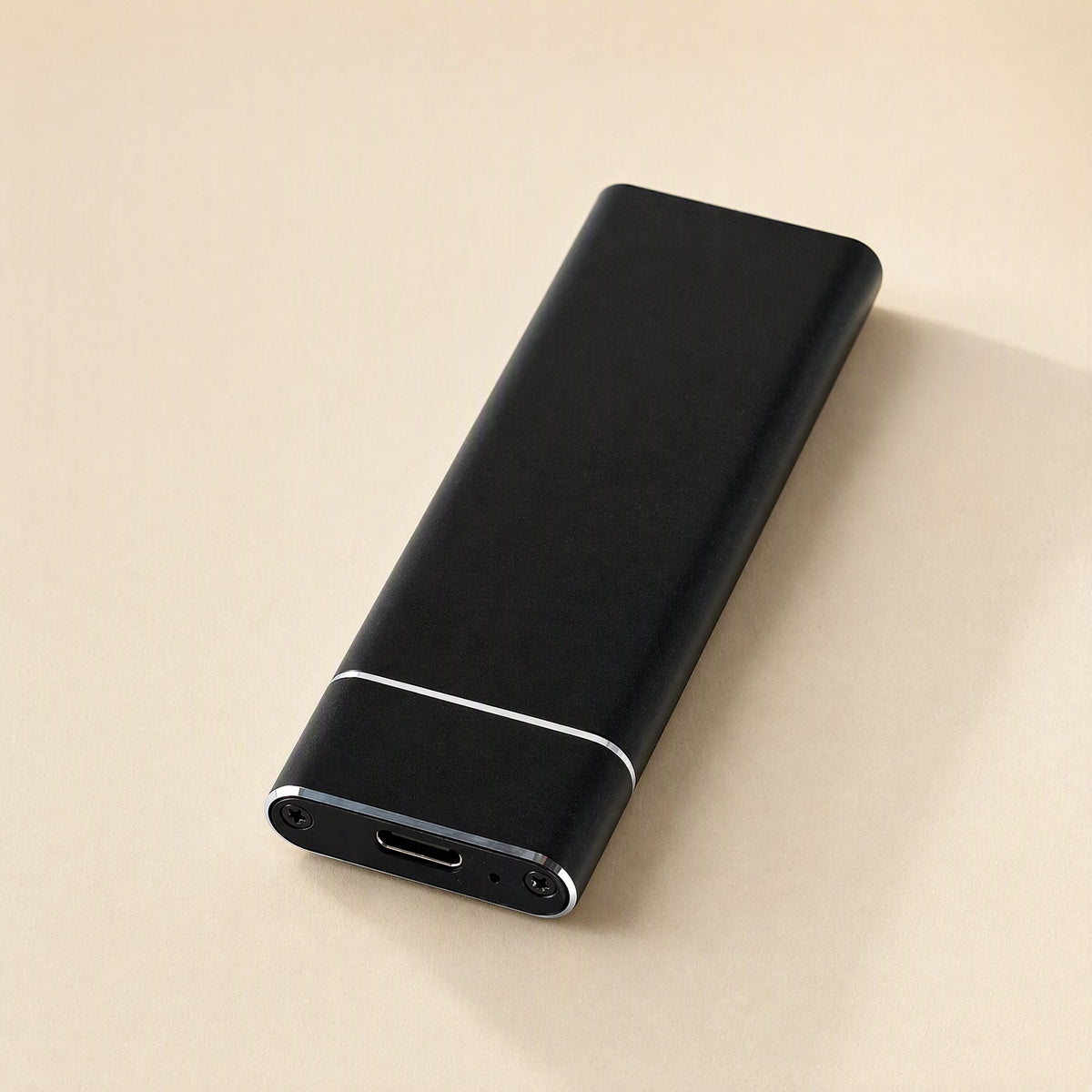 Bytecove – Black aluminum M.2 SSD enclosure lying flat, showing the USB-C port and screws at one end