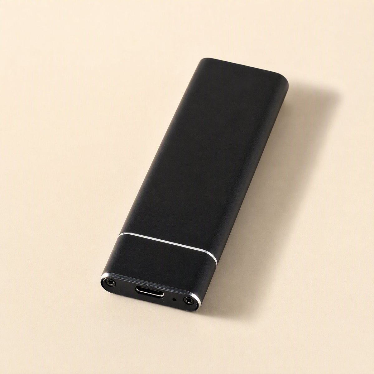 Bytecove – Black aluminum SSD enclosure from a slightly different angle, with USB-C port and two screws visible