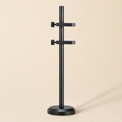 Stronghold – Black bracket with two adjustable arms and knurled thumbscrews on a round base, front view