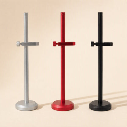 Stronghold – Silver, red and black brackets standing in a row, each with one clamp arm and a round base