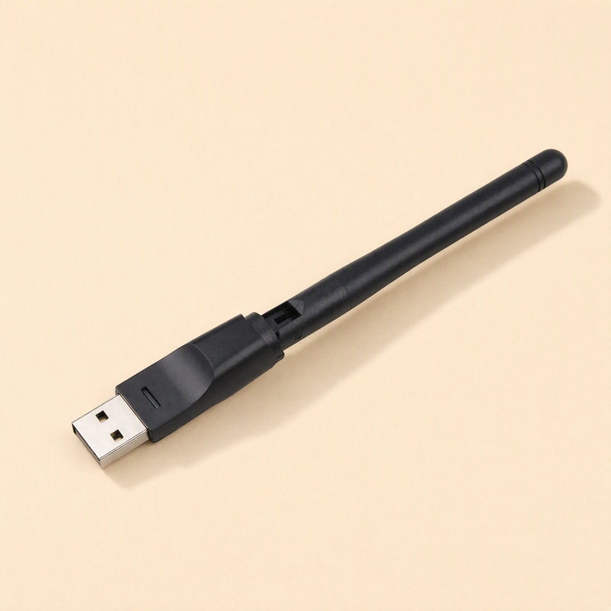 Signalstem – Black USB network adapter lying flat with antenna folded down, USB connector at left