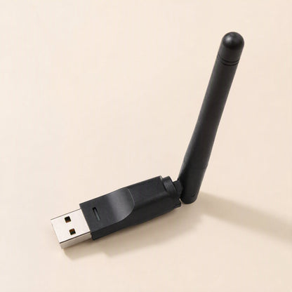 Signalstem – Black USB wireless adapter standing at an angle with the antenna raised, viewed from the connector end