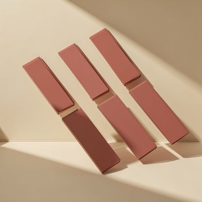 Chipchill – Six terracotta-coloured rectangular thermal pad strips propped in diagonal rows in angled sunlight