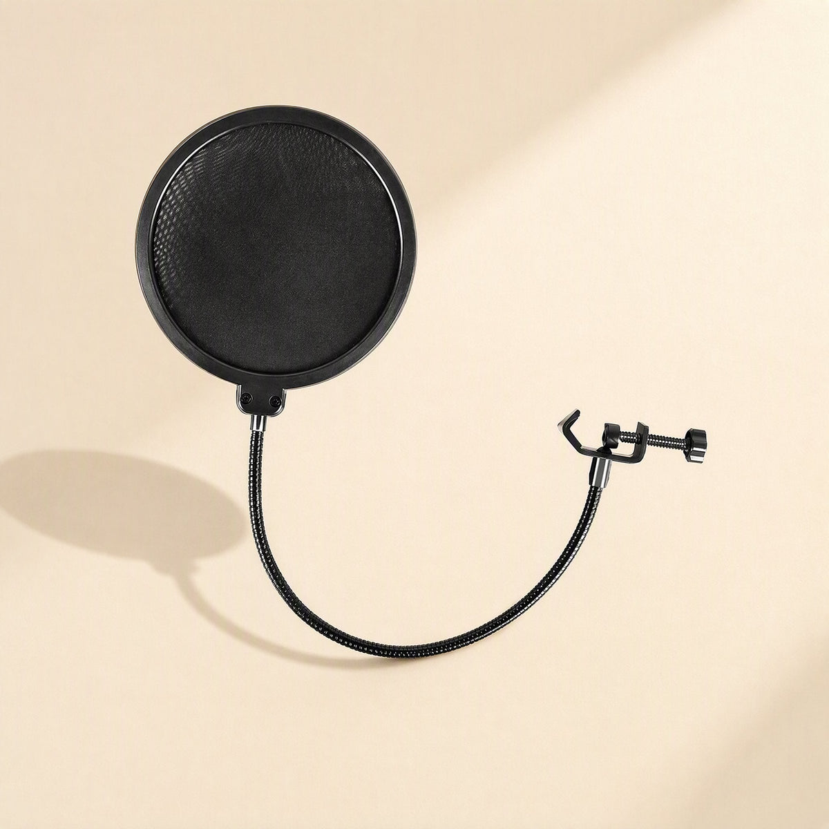 Windveil Double-Layer Microphone Pop Filter with round black mesh screen and curved gooseneck on cream backdrop