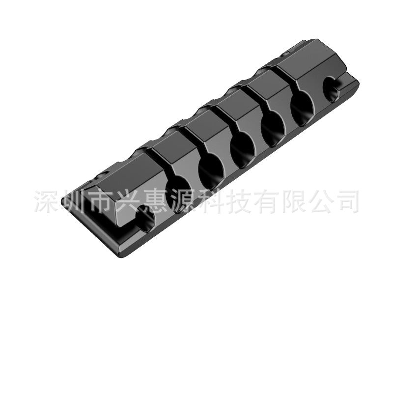 Meshcoil Silicone Cable Storage Net Organizer – close-up of a black six-slot cable clip strip with a screw hole at each end