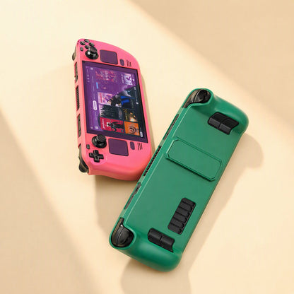Deckshield – Pink front shell on a Steam Deck beside a green case back with grip cutouts and a kickstand panel