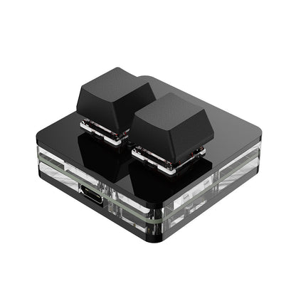 Tapnest – Black two-key keypad with a clear layered acrylic base and a Type-C port, shown from a front angle
