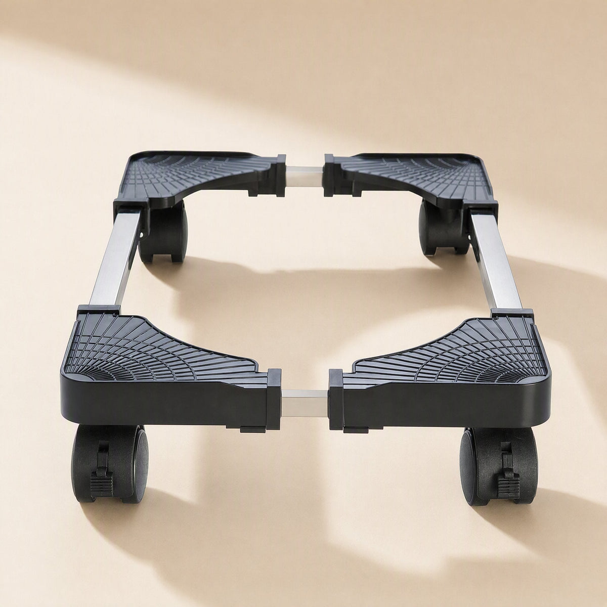 Rollstand – Front view of the black stand's adjustable metal side rails and corner pads, with wheels at each corner