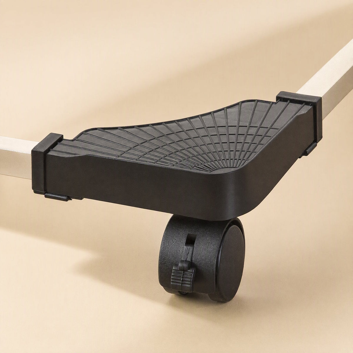 Rollstand Computer Tower Stand – close-up of a corner pad with a ribbed surface, a locking caster wheel and a metal rail end