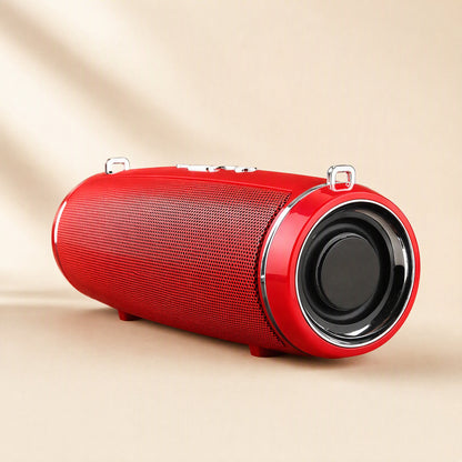 Strapsonic Bluetooth Speaker – red speaker standing on small feet, showing the front driver, mesh grille and top strap loops