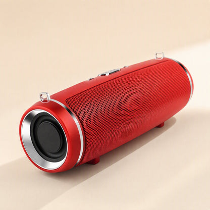 Strapsonic – Red speaker viewed from above at an angle, showing top control buttons, strap loops and mesh body