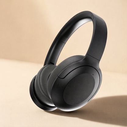 Hushsound Bluetooth Noise-Cancelling Headphones in black, angled view on a warm beige background