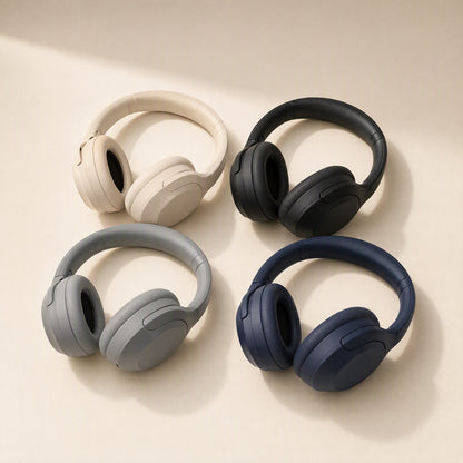 Hushsound – Four over-ear headphones in cream, black, grey and navy arranged on a light beige surface