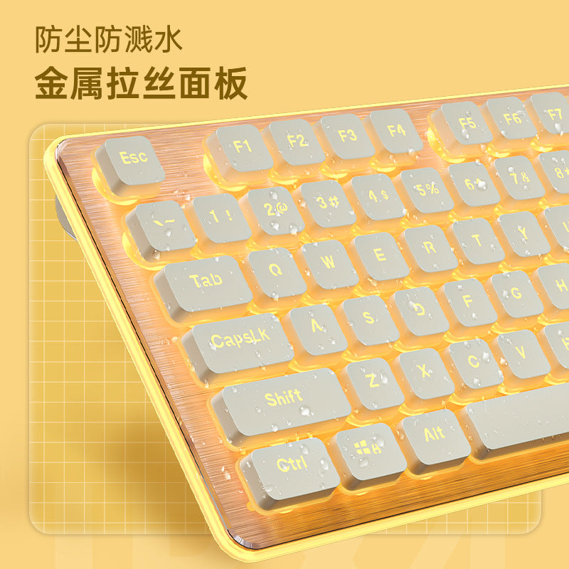 Clacknest – Close-up of brushed metal keyboard panel with water droplets on cream keycaps and yellow backlighting