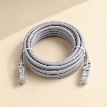 Wirebridge Cat6 Network Cable – gray coiled Cat6 cable with a white tie and RJ-45 connectors at each end on a beige surface