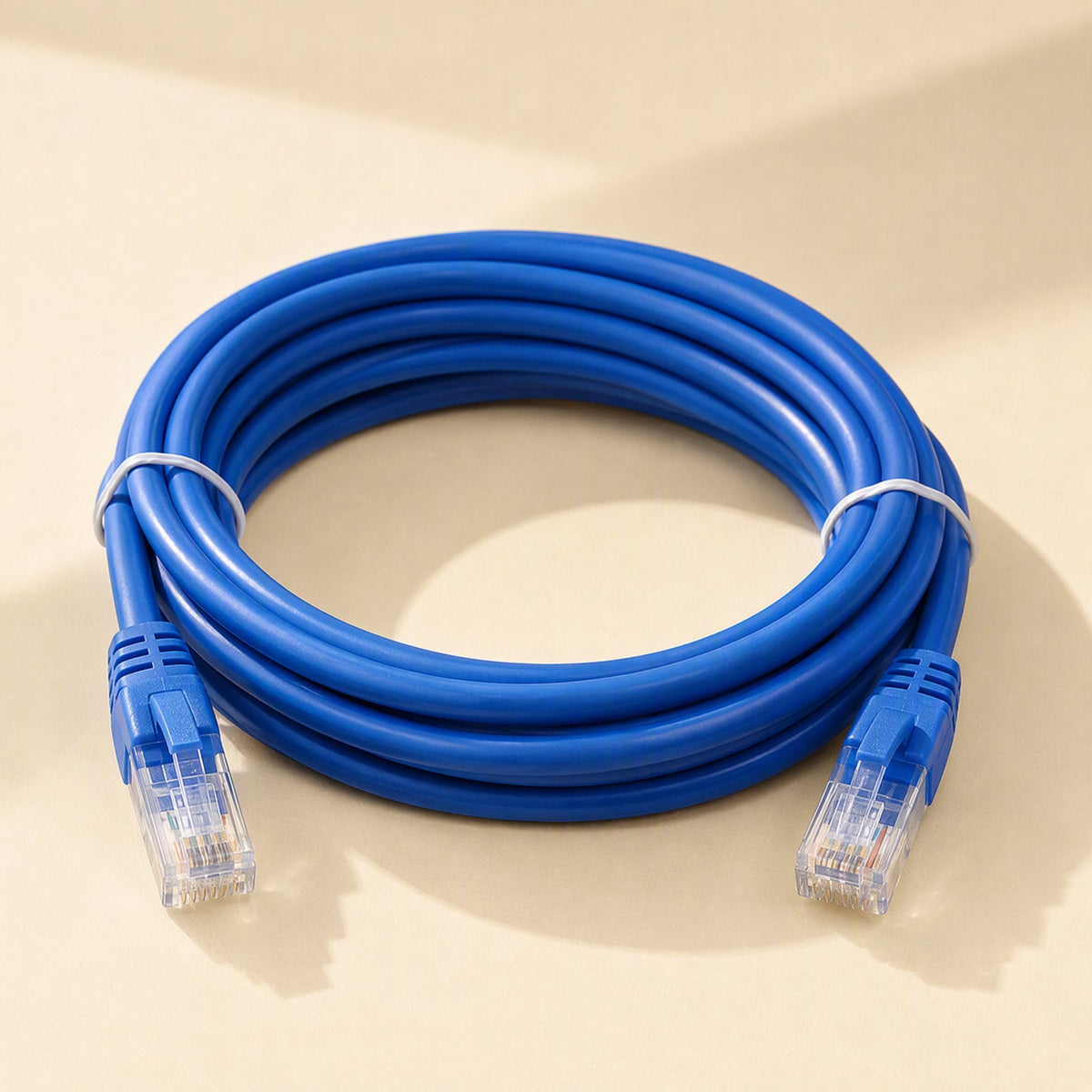 Wirebridge Cat6 Network Cable – blue Cat6 cable in a compact coil with two white ties and clear RJ-45 plugs at both ends