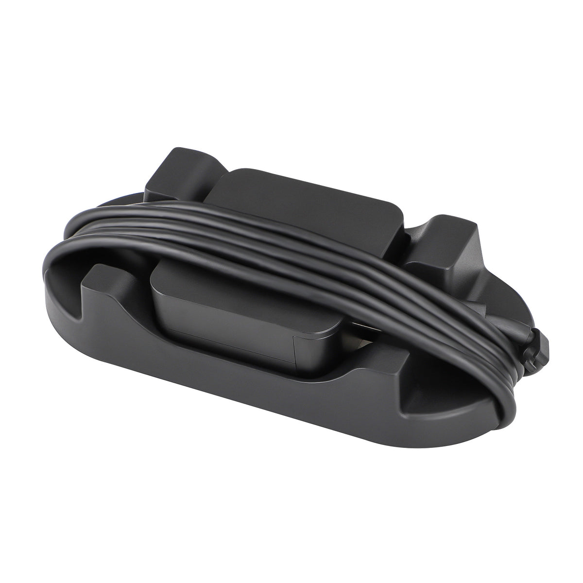 Draxbase – Black stand base with a power cable wrapped around it and an adapter resting in the centre