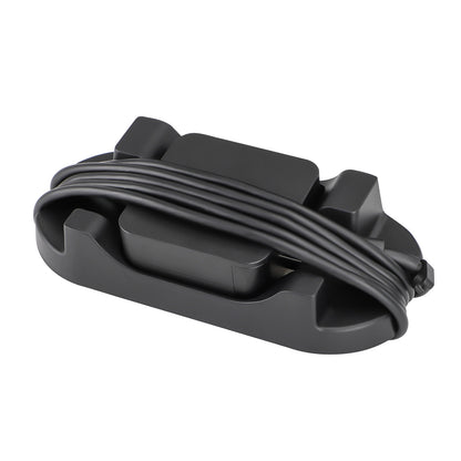 Draxbase – Black stand base with a power cable wrapped around it and an adapter resting in the centre
