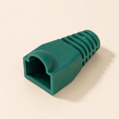 Plugcloak – Single green plastic RJ45 boot with ribbed strain relief, shown at an angle on a cream surface