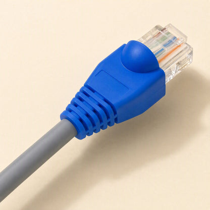 Plugcloak – Blue RJ45 boot fitted over a clear connector on a grey network cable, close-up