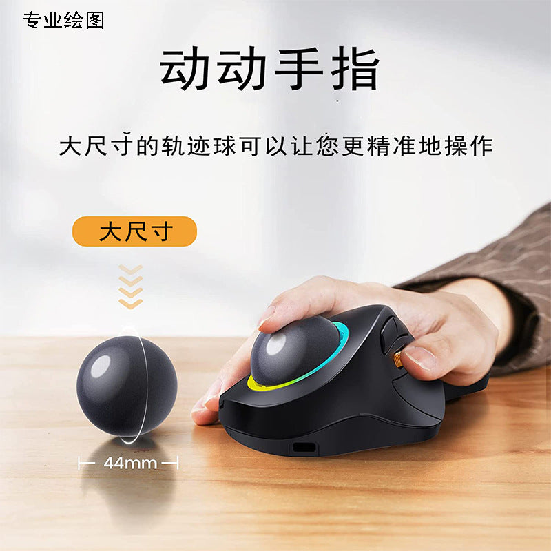 Rollbright – Hand resting on the black trackball mouse, with a 44mm trackball beside it and a USB-C port at the front