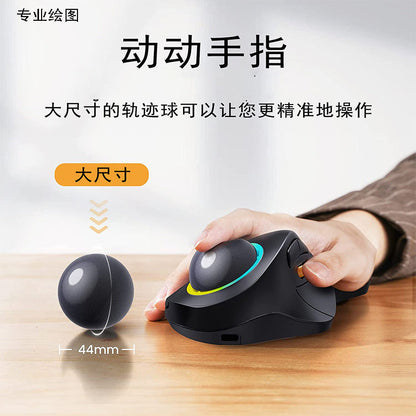 Rollbright – Hand resting on the black trackball mouse, with a 44mm trackball beside it and a USB-C port at the front