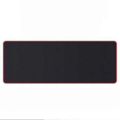 Rubberglide – Extra-long black desk mat with red stitched edge, shown flat from above on a white background