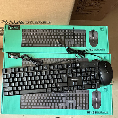 Clicktide – Stacked teal boxes with a black keyboard and optical mouse, cables coiled, in a warehouse setting