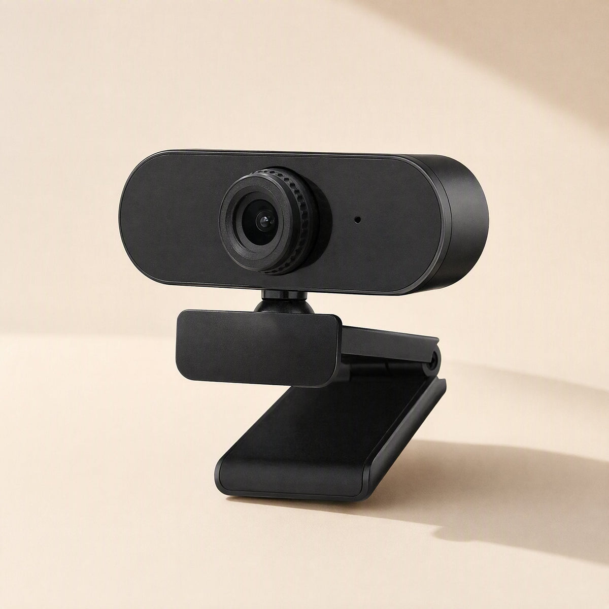 Clearlook 4K USB Computer Camera in black, angled front view with clip stand on a cream background
