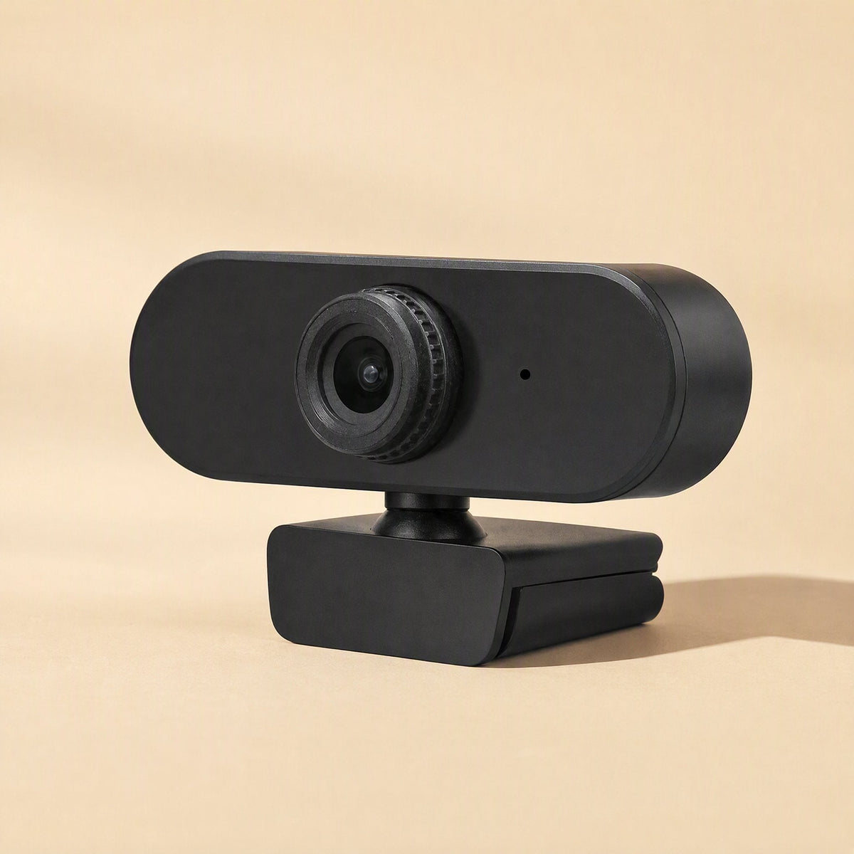Clearlook 4K USB Computer Camera – black webcam with ridged lens ring and small microphone dot, side view on a peach backdrop