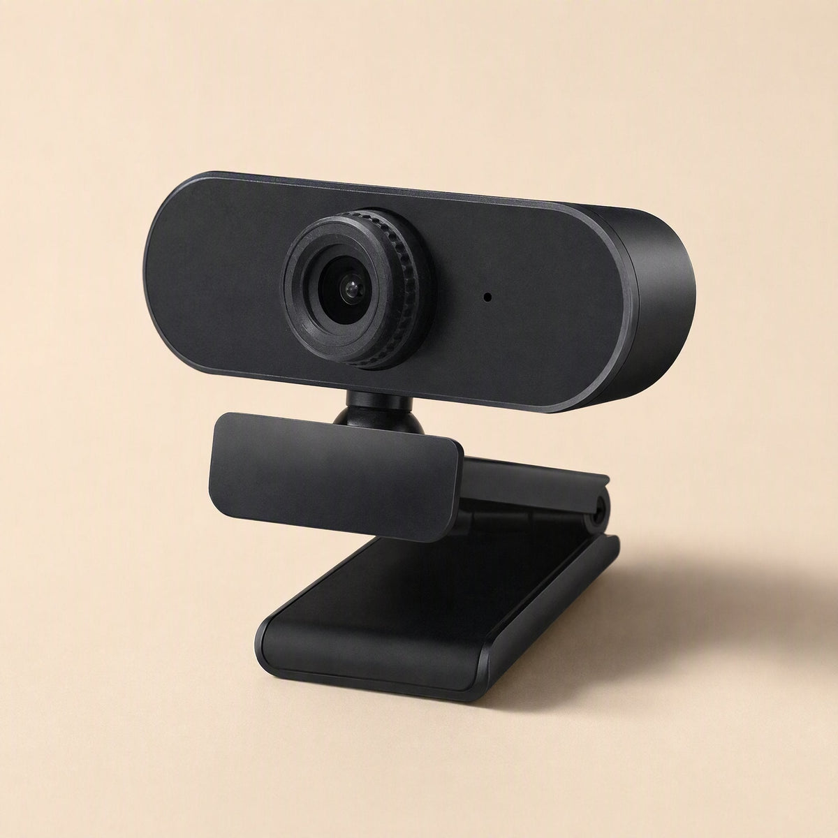 Clearlook 4K USB Computer Camera – black webcam with the clip open, shown at an angle from above on a beige background