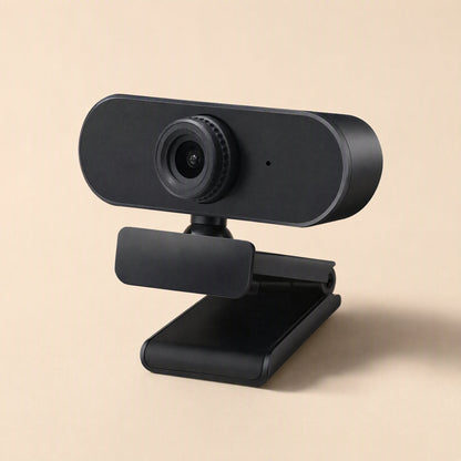 Clearlook 4K USB Computer Camera – black webcam with the clip open, shown at an angle from above on a beige background