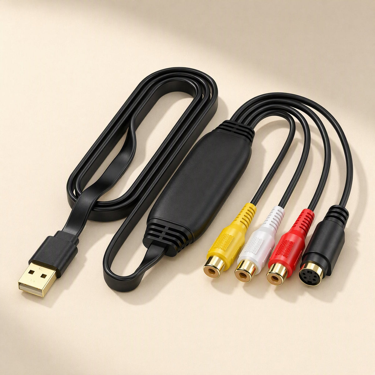 Framegrab – Close view of the USB capture cable with yellow, white, red RCA jacks and black S-Video port on cream backdrop