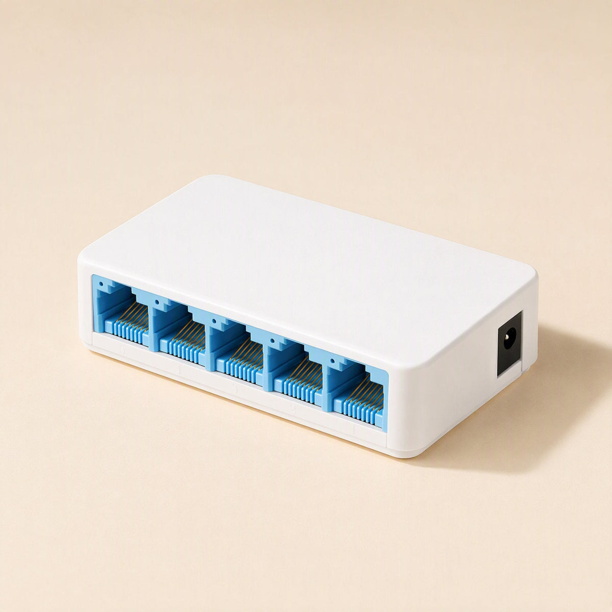 Netweave – Compact white 5-port switch with blue-lined ports and power socket at the side, three-quarter view