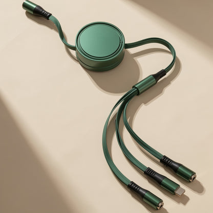 Reelcord – Green flat-style retractable cable with round reel, extended with three connector tips, on a beige surface