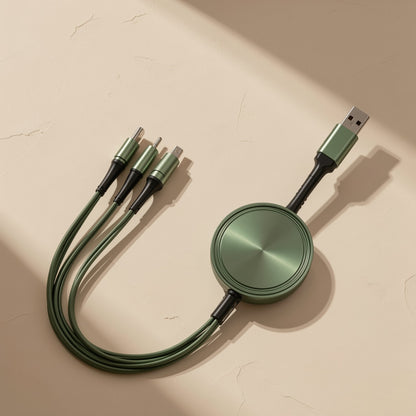 Reelcord – Green round-reel charging cable with USB plug and three braided branches, top-down view on cracked beige