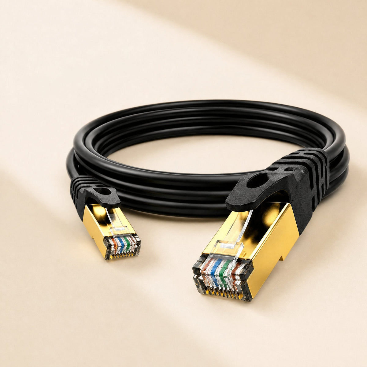 Copperlink CAT7 Network Cable coiled in black with gold-plated shielded RJ-45 connectors on a beige background