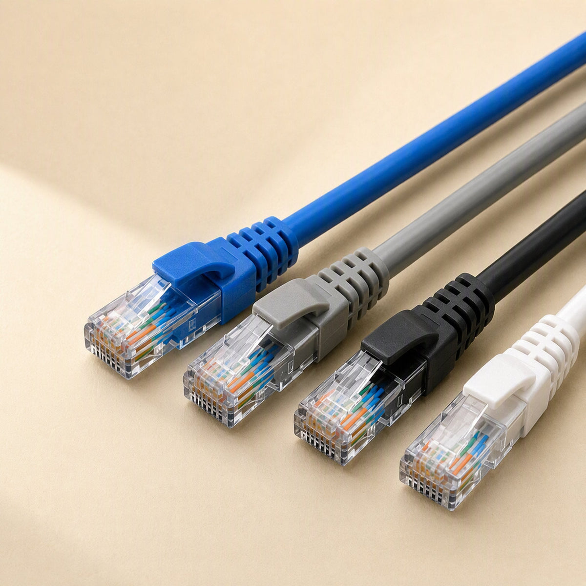 Copperlink – Close-up of blue, grey, black and white network cable ends showing clear plugs and visible colored wires