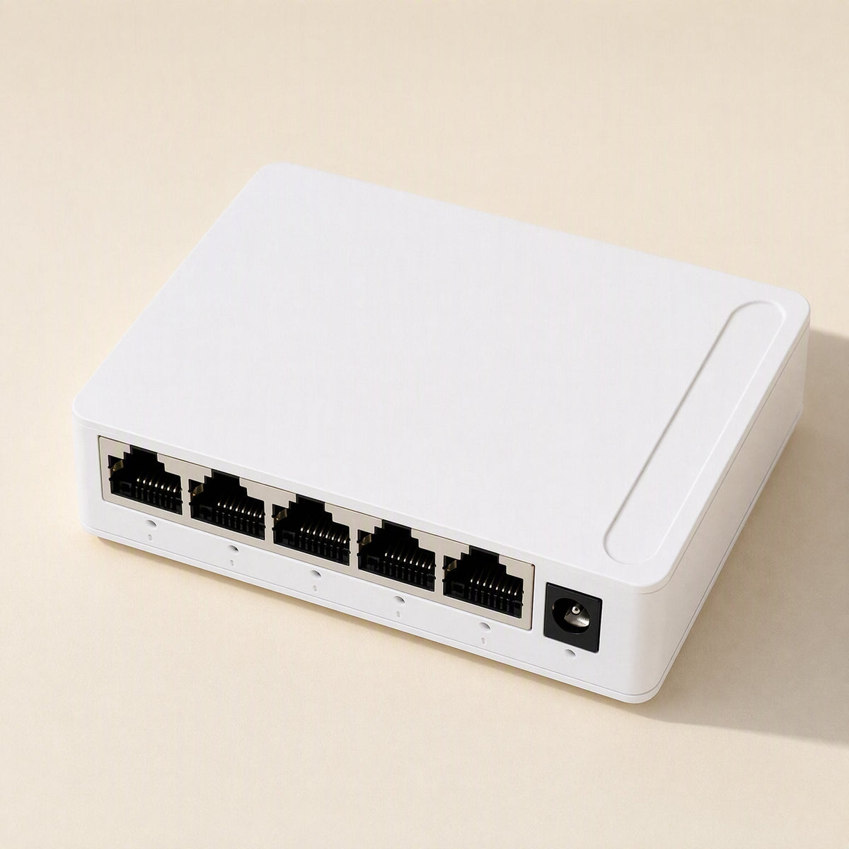 Packetweave Network Switch – white 5-port switch from a rear angle with the power jack at the right end