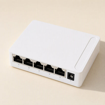 Packetweave Network Switch – white 5-port switch from a rear angle with the power jack at the right end