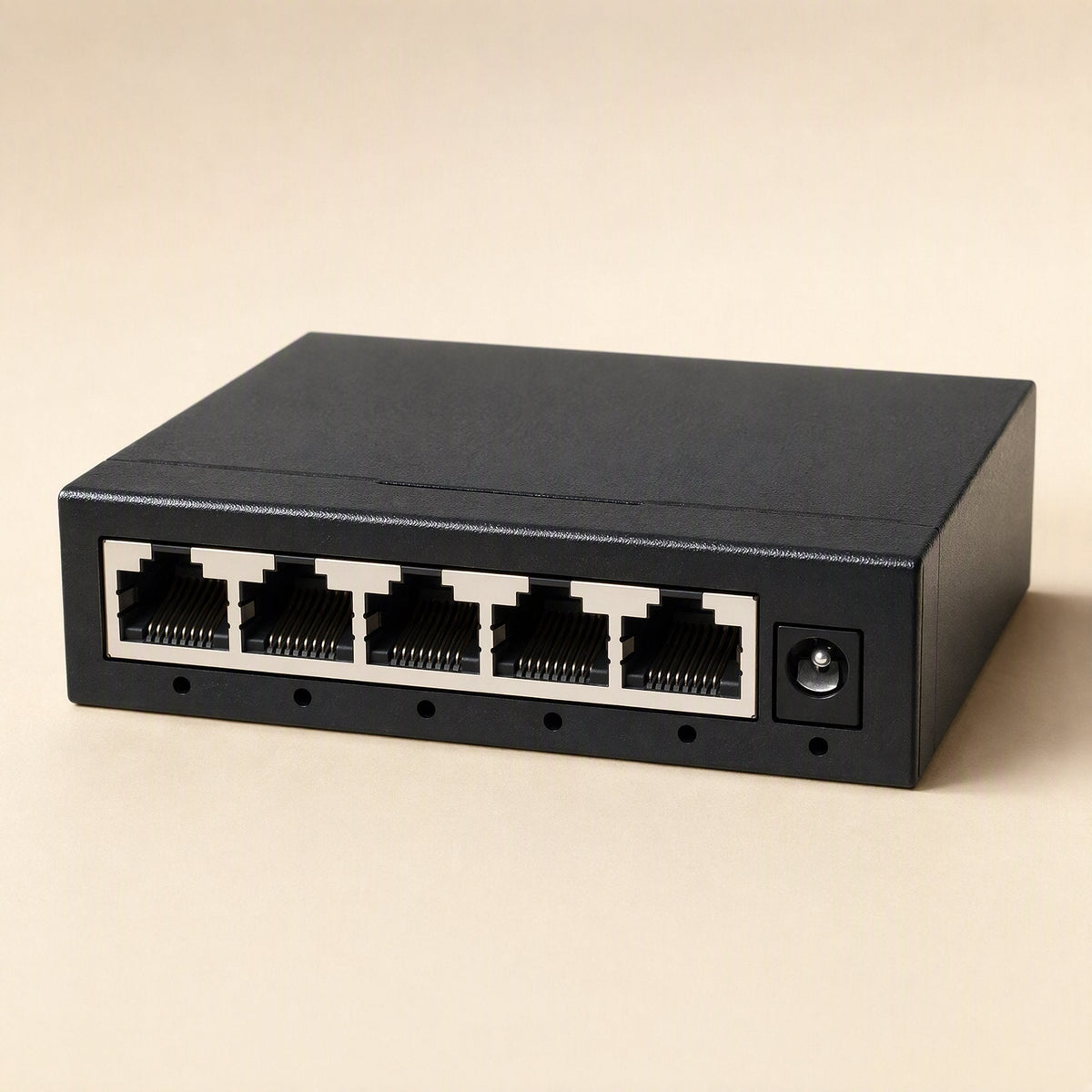 Packetweave Network Switch – black metal-cased 5-port version with light-colored port surrounds and a power jack
