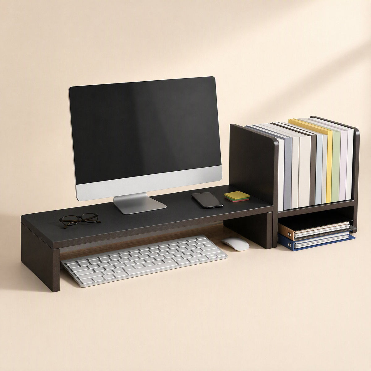 Shelfraise – Black stand under a desktop monitor with keyboard and mouse below, books and folders on the right shelf