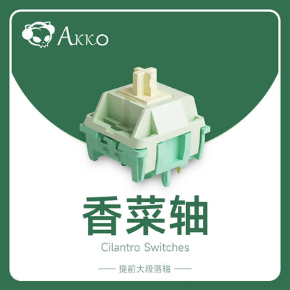 Keygrove Wired Mechanical Keyboard switch in mint green and cream on a green Akko Cilantro Switches graphic