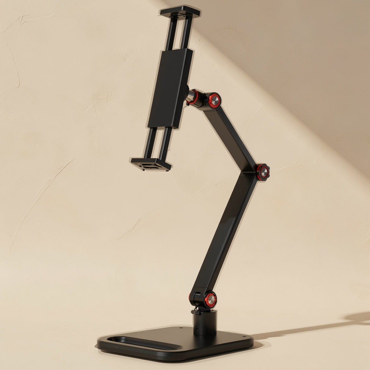 Aluperch – Black adjustable-arm phone and tablet holder with red-ringed joints and a flat weighted base, full view