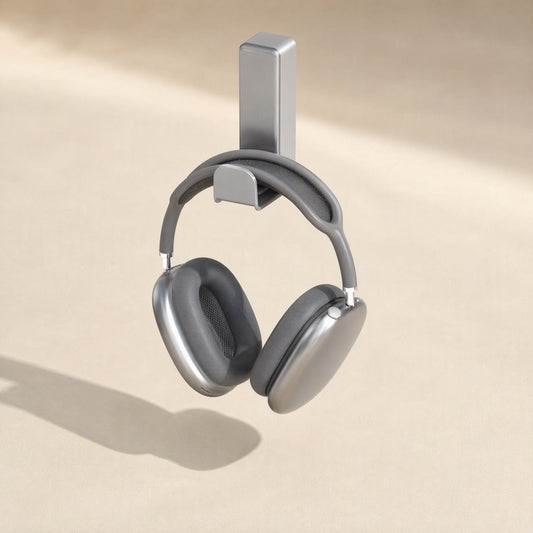 Spinrest Headphone Stand with gray over-ear headphones hanging from the hook on a beige background