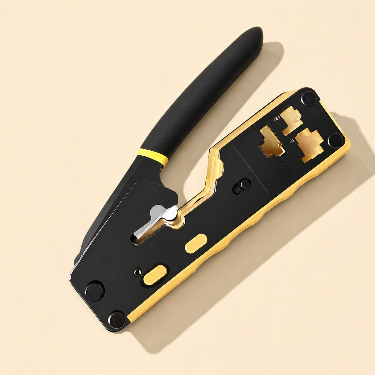 Cablepress network cable crimping pliers, black and yellow, seen from above at an angle on a cream background
