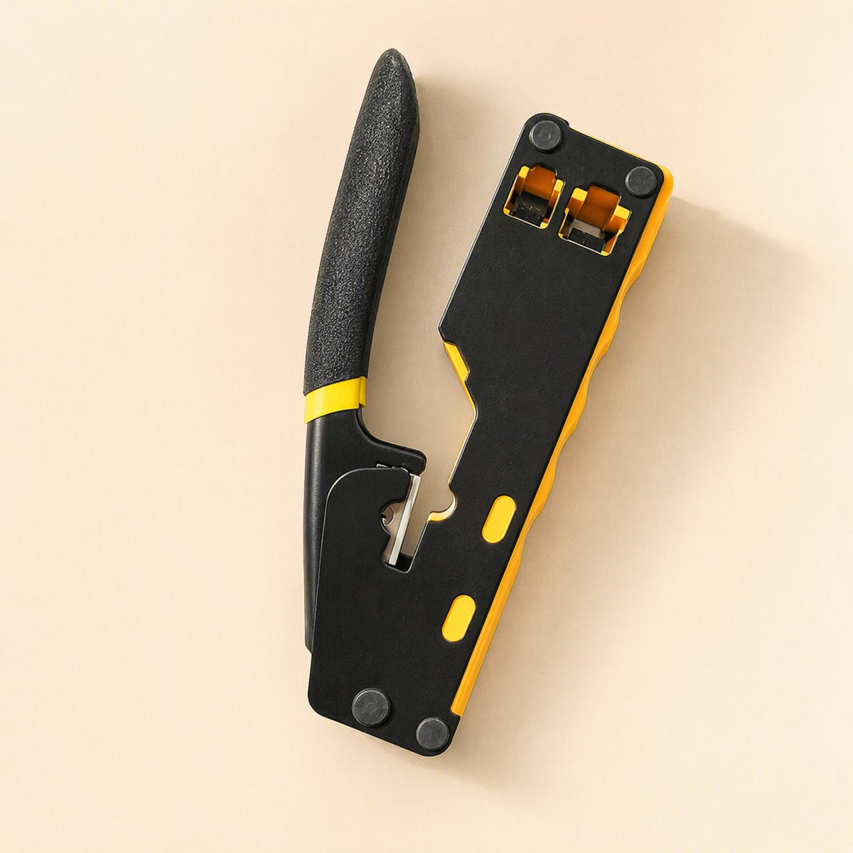 Cablepress – Pliers held upright, showing the textured black handle with a yellow band and the open cutting notch