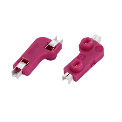 Switchwell – Pair of magenta hot-swap sockets, one showing the contact clips below and one showing the round top openings